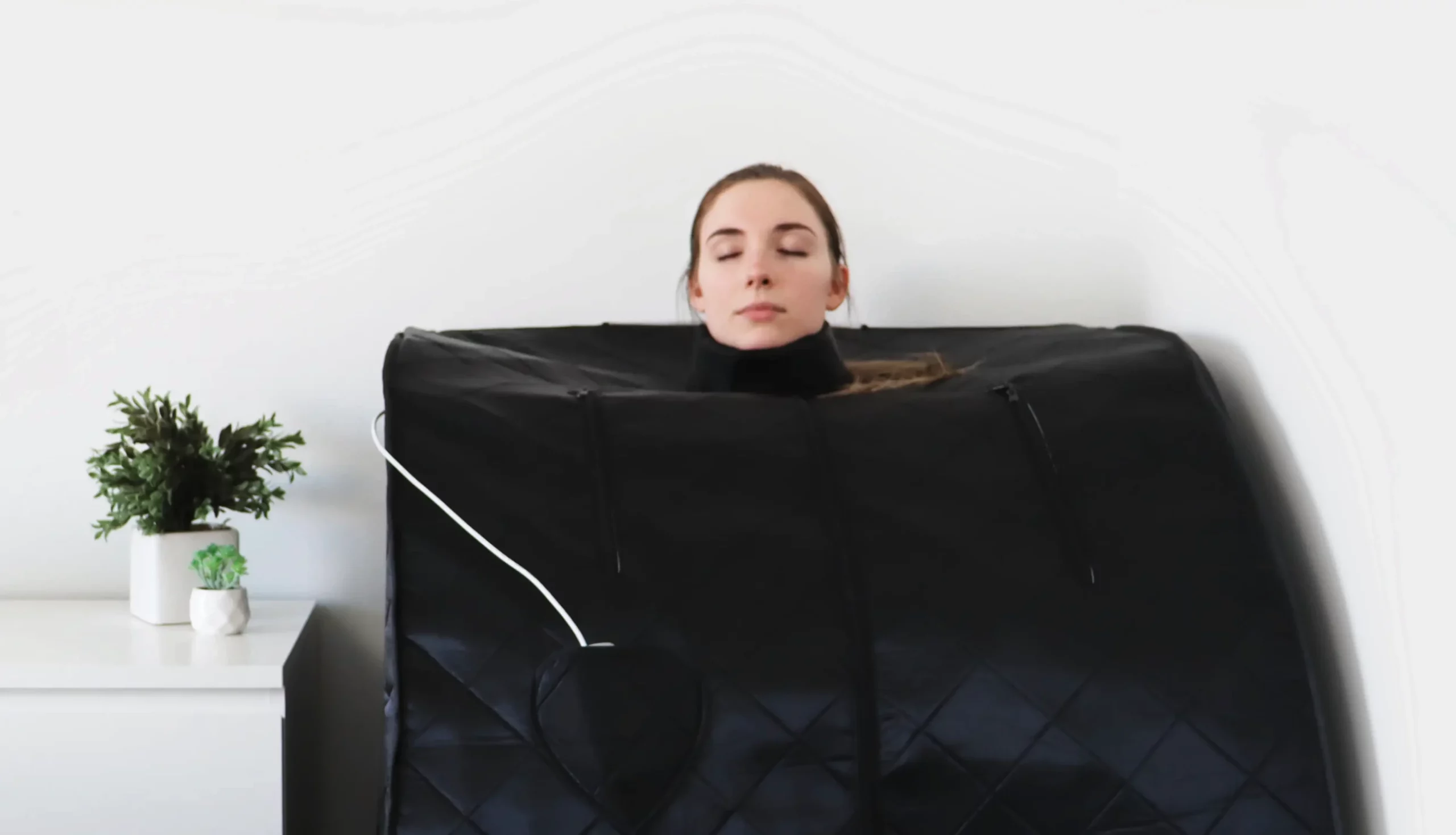 woman in ultralux foldaway sauna