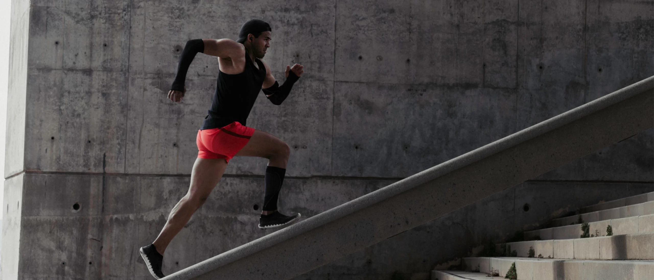 black-athlete-sprinting-up-stairs-excercising