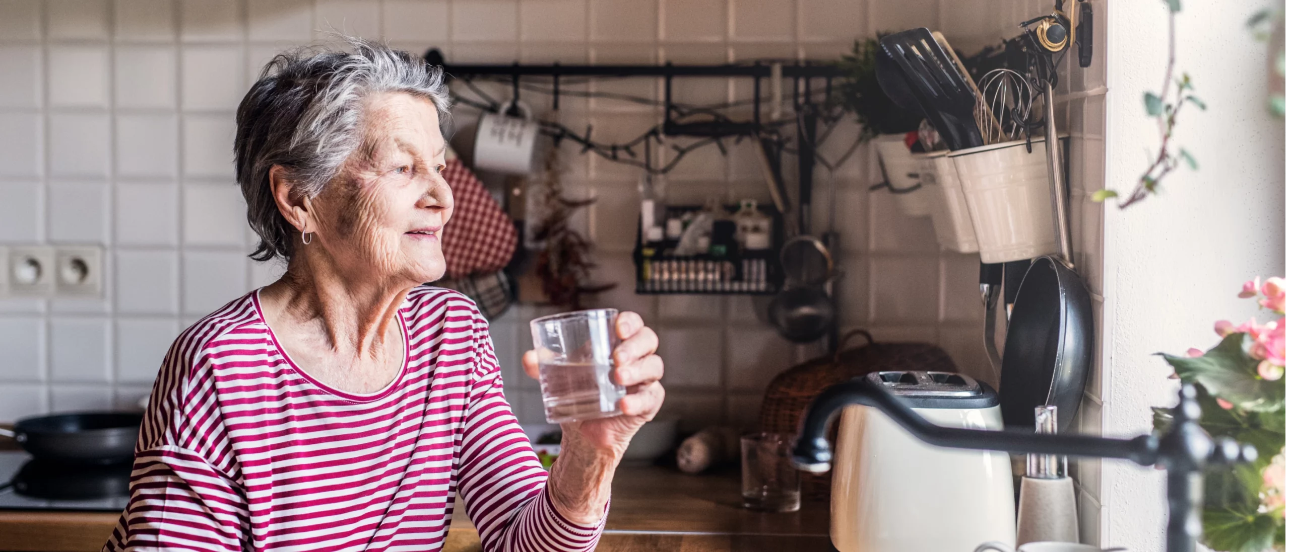 elderly-woman-drinking-a-glass-of-water