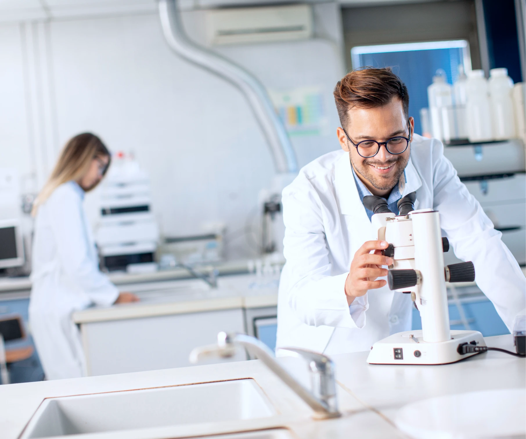 scientist-looking-through-microscope