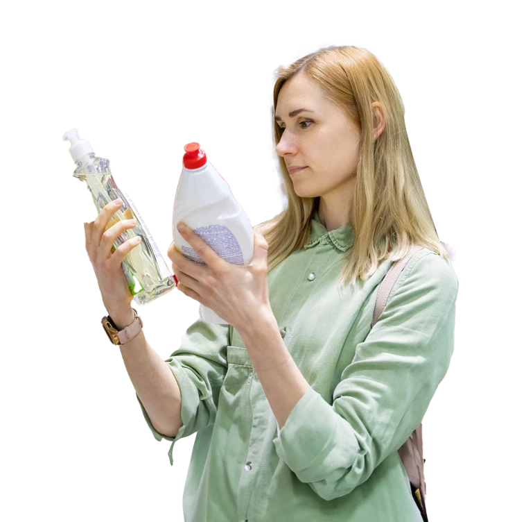 woman comparing common household cleaners