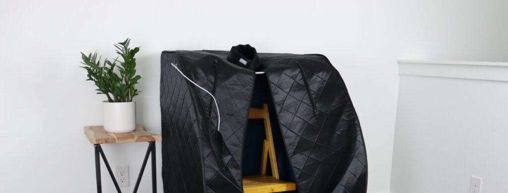 Foldaway sauna with a plant to the left