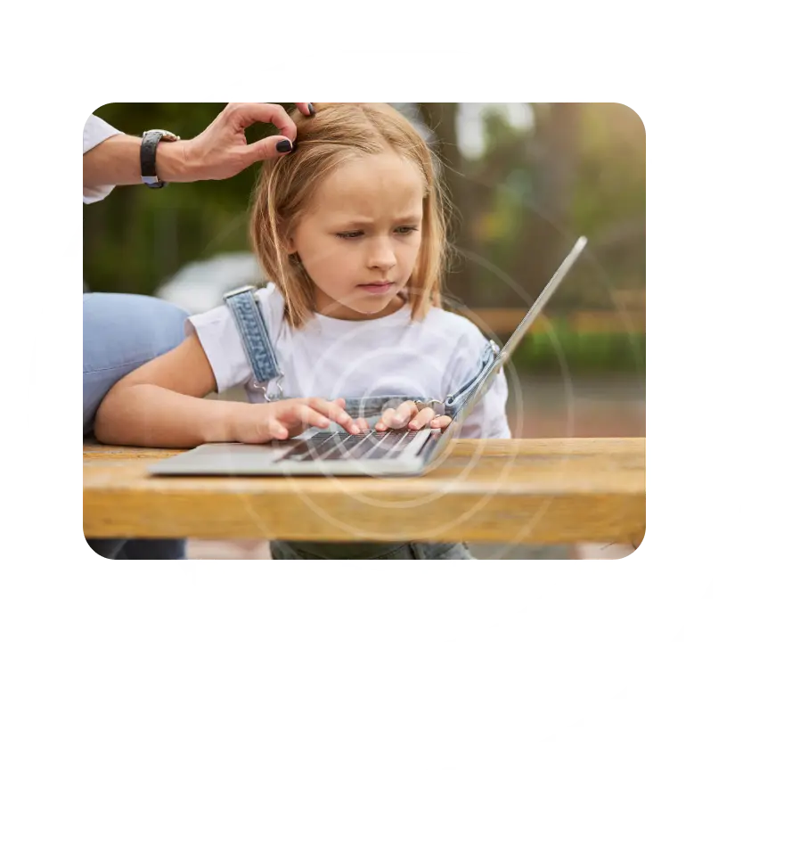 toddler girl using a laptop