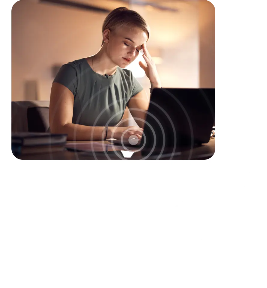 woman with headache using a laptop